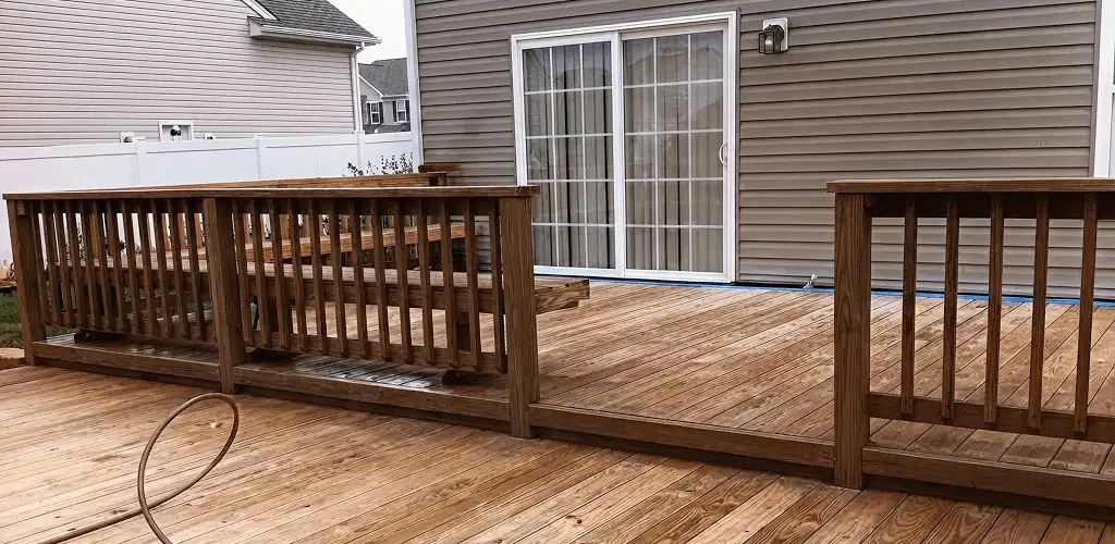 Deck sealing service protecting a backyard wood deck and railings in Dayton, OH
