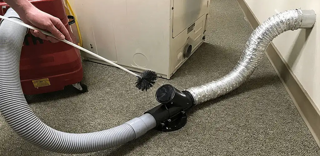 Dryer vent cleaning service removing lint from a dryer duct connection in Dayton, OH