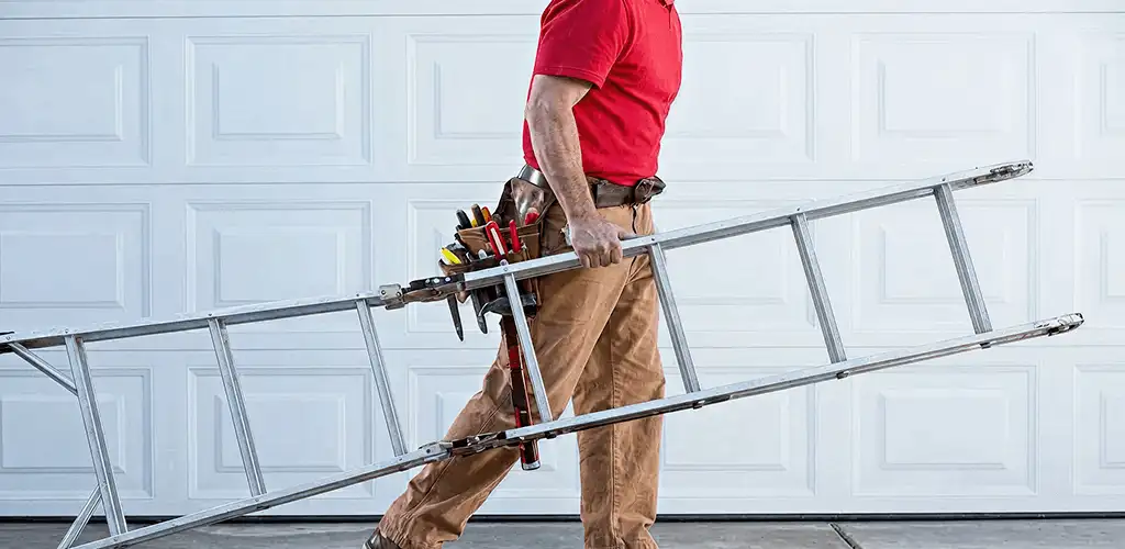 Garage door repair technician arriving with tools and ladder in Dayton, OH