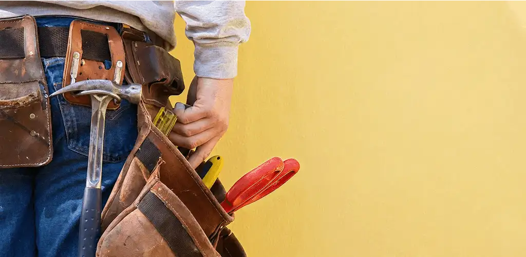 Handyman with tool belt ready for home repairs and maintenance in Dayton, OH