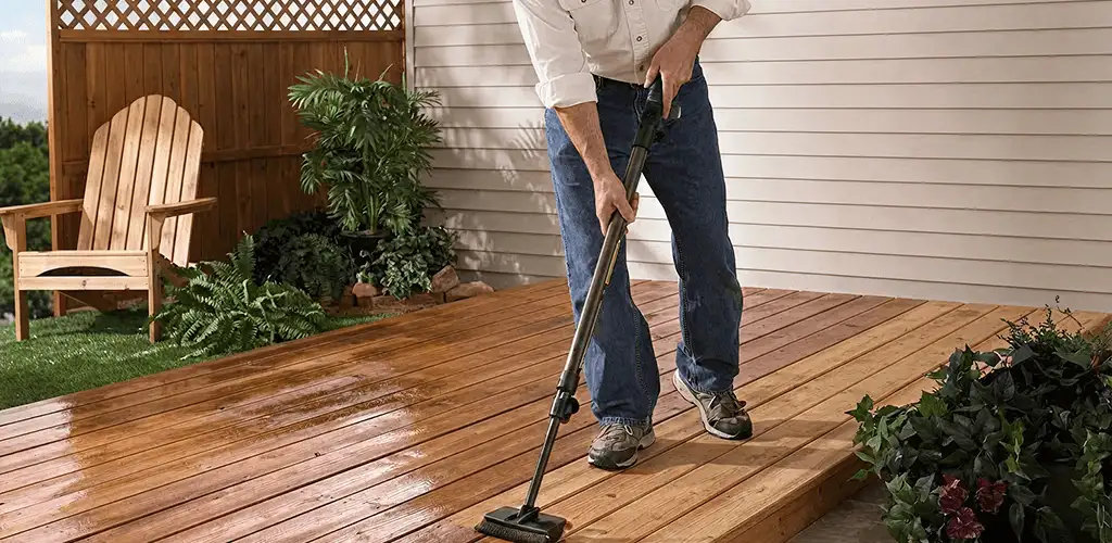 Deck staining service applying stain to a backyard wood deck in Dayton, OH